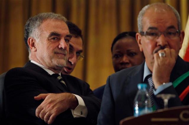 ICC Chief Prosecutor Moreno-Ocampo and member of Libya's NTC al-Alagi give a joint news conference in Tripoli