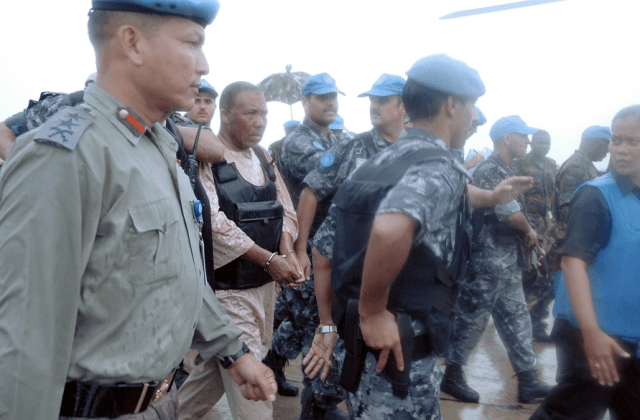 Charles Taylor arrested Charles Taylor handcuffed