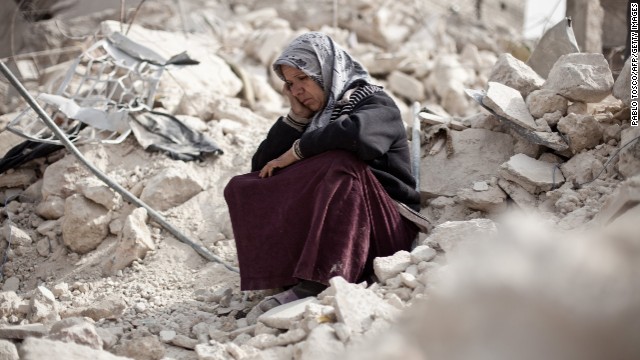 A woman sits amidst rubble in Aleppo (Photo: CNN, Pablo Tosco / AFP / Getty Images)