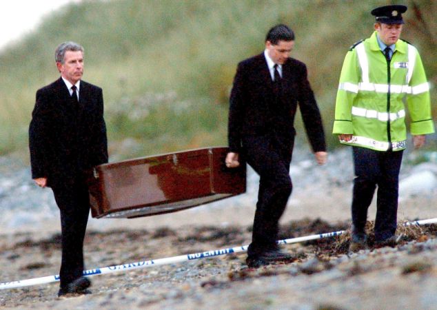 The remains of Jean McConville are removed from the Shelling Hill Beach location where they were finally found in 2003 (Photo: Alan Lewis)