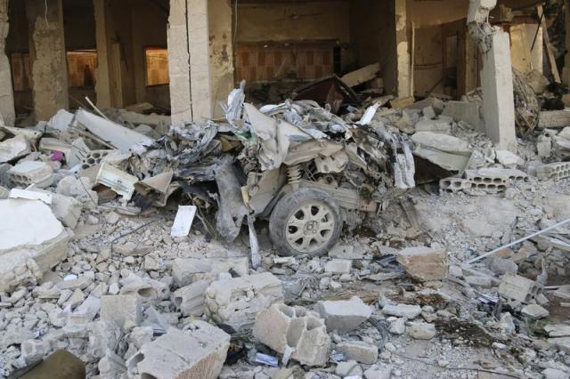 Wreckage of a car in Kaheel village, Syria (Photo: Mohamed Fares/ Thomson Reuters)