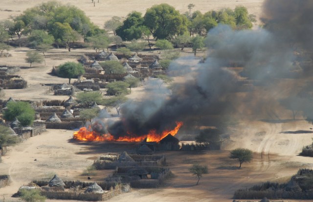 A village in Darfur burns following an attack (Photo: Eric Reeves)