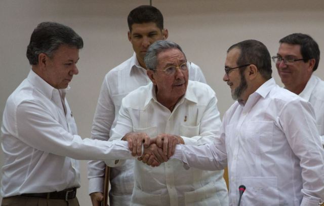 An awkward handshake but a remarkable breakthrough (Photo: AP)