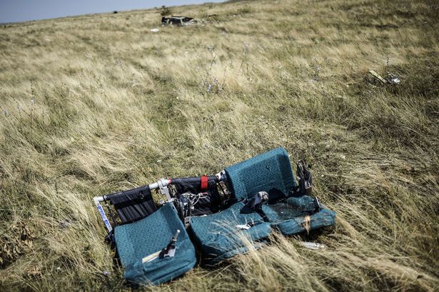 A row of empty seats from flight MH17 lies in a field in eastern Ukraine (Photo: Getty)