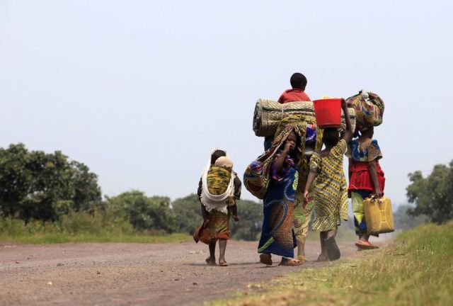A family flees violence and heads towards Goma in the Eastern DRC (Photo: James Akena / Reuters)