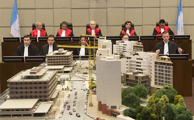 Judges at the Special Tribunal for Lebanon look over a model of the area of Beirut where former Prime Minister Rafiq Hariri was assassinated (Photo: STL)