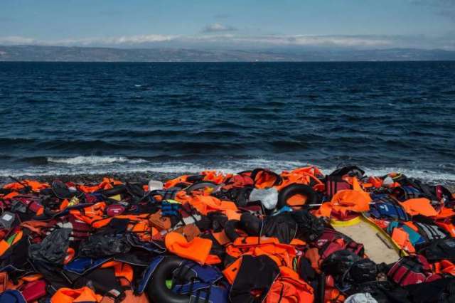Life jackets from refugees escaping violence in Syria and elsewhere lay strewn on the shores of Lesbos, Greece. (Photo: EPA)