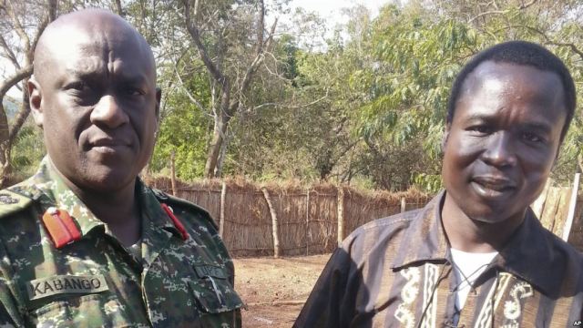 Col Michael Kabango of the UPDF stands with Dominic Ongwen shortly after coming into Ugandan custody (Photo: AP)